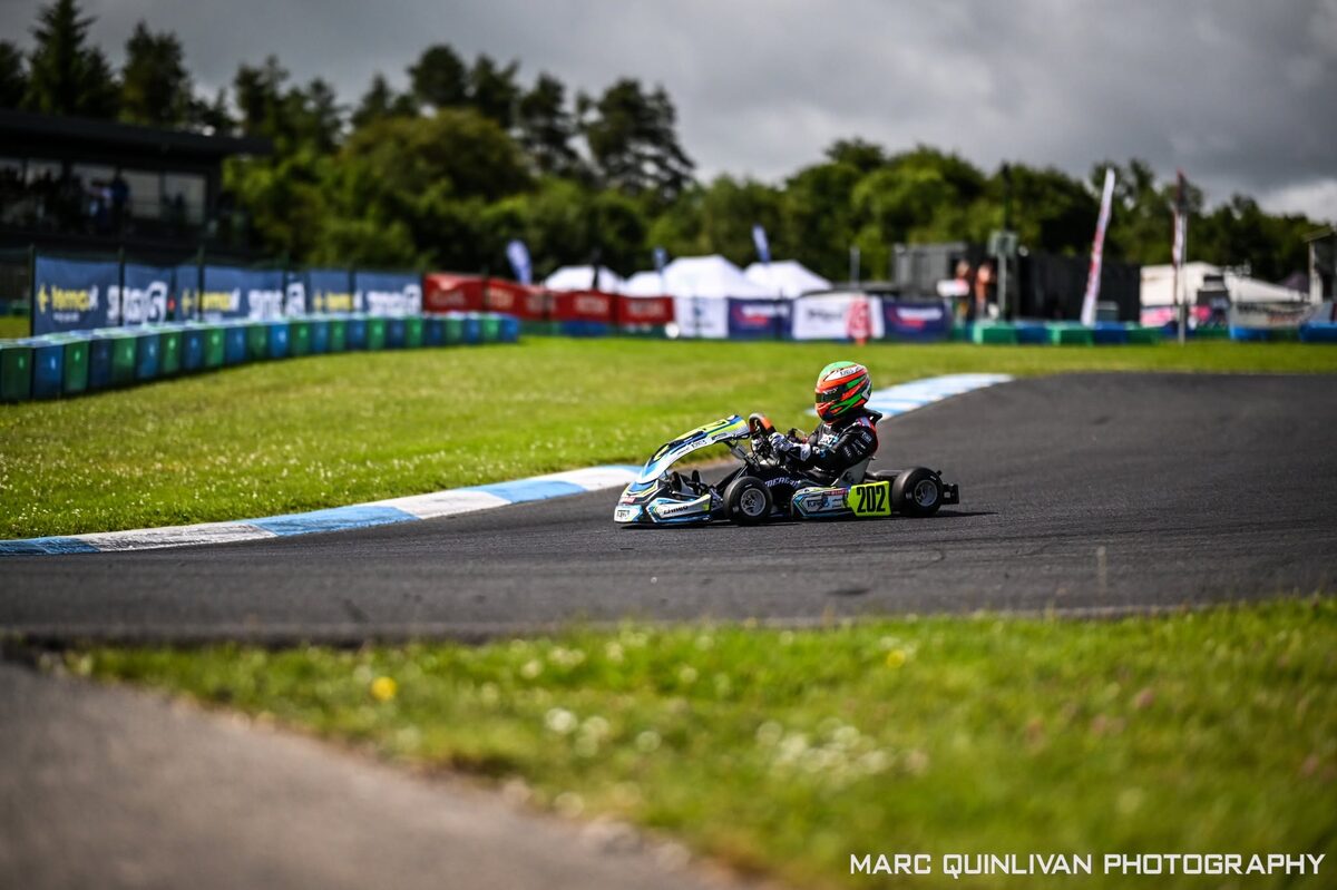 Oliver Meredith leading a group of karts through a corner