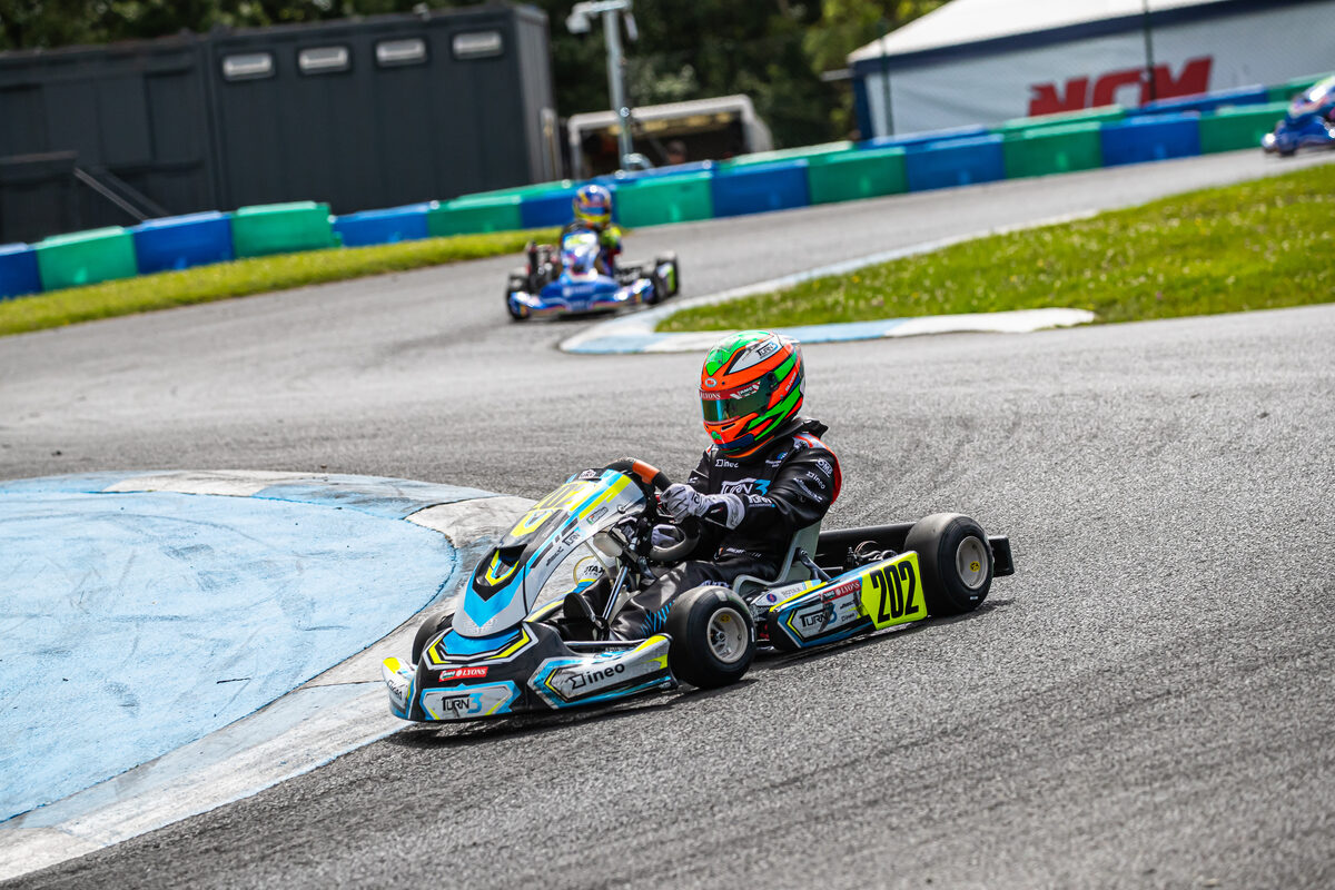 Oliver Meredith cornering with another kart close behind