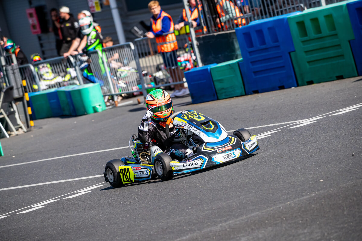 Oliver Meredith giving a thumbs up on track